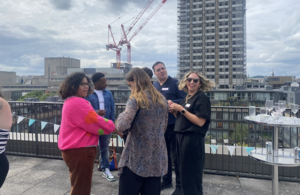 A photograph of people on a roof in London at a Wikimedia meetup in the summer of 2024.
