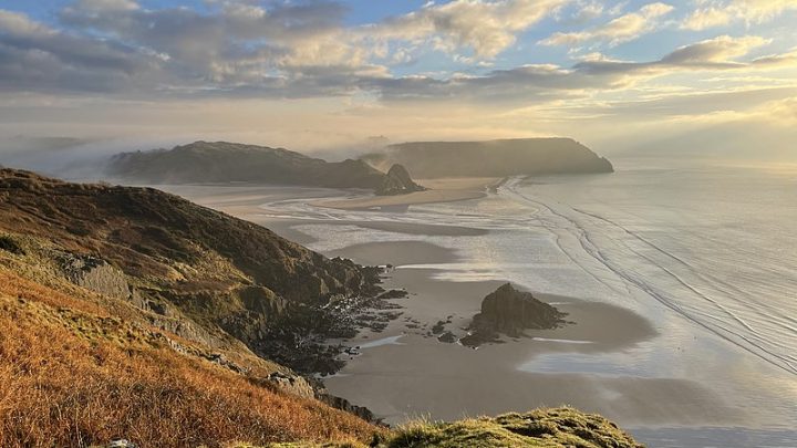 Sunrise over Three Cliffs Bay in Gower